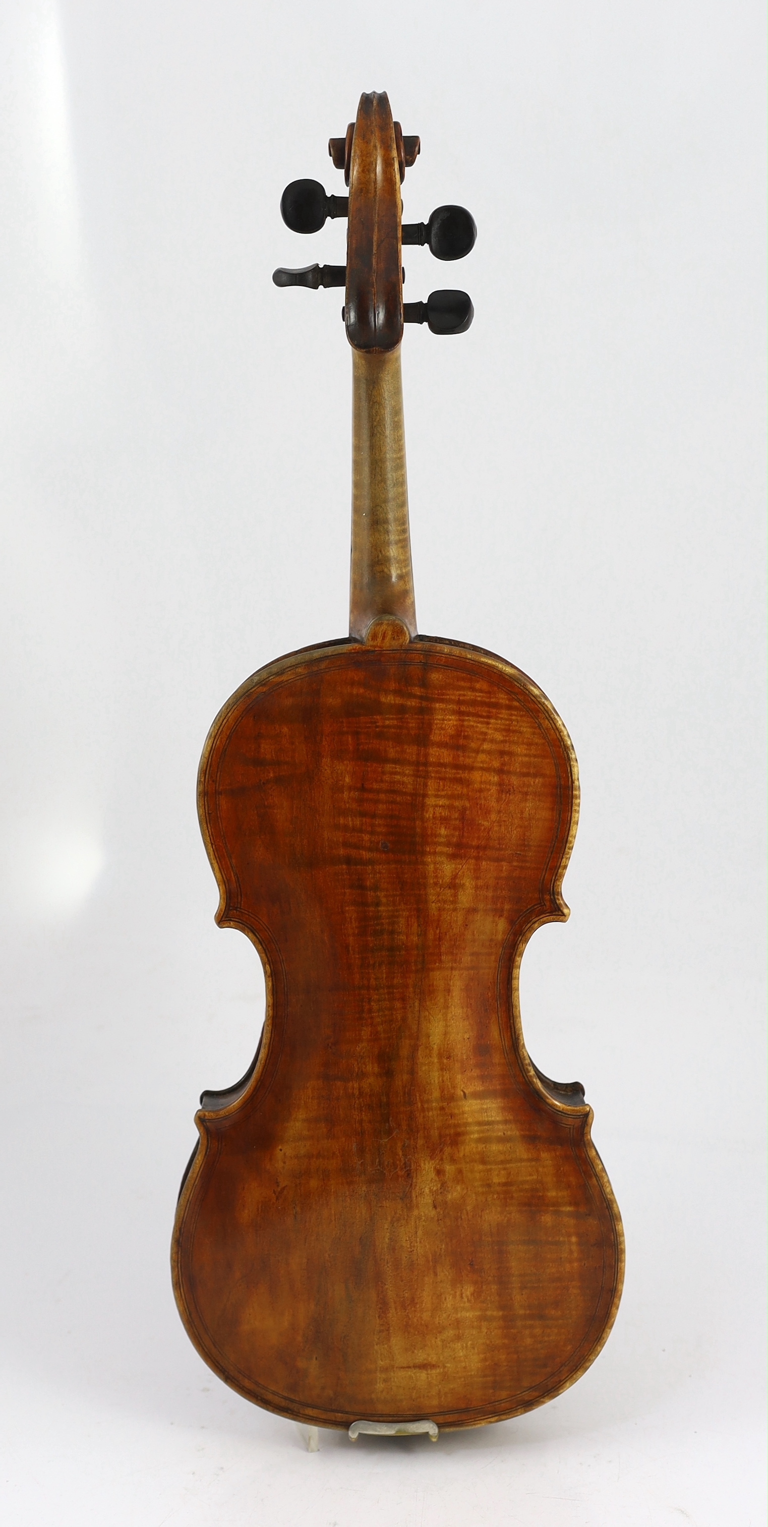 An 18th century violin, labelled ‘New Back by James Carroll, Maker, Manchester 1899’, length of back 36.5cm